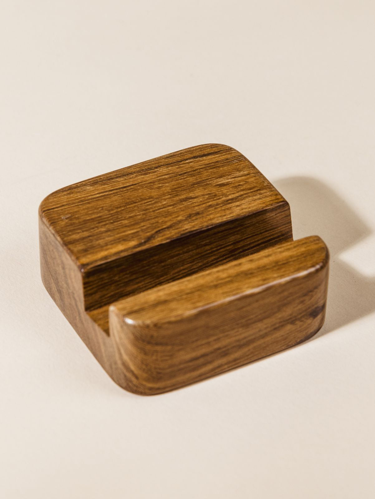 Closeup of wood cellphone stand with no logo engraved. 