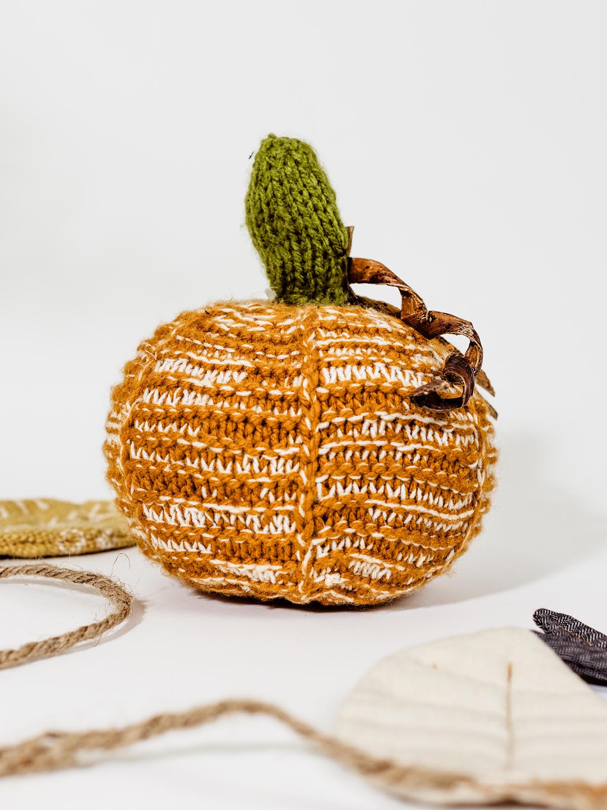 Crocheted Pumpkin on white background.