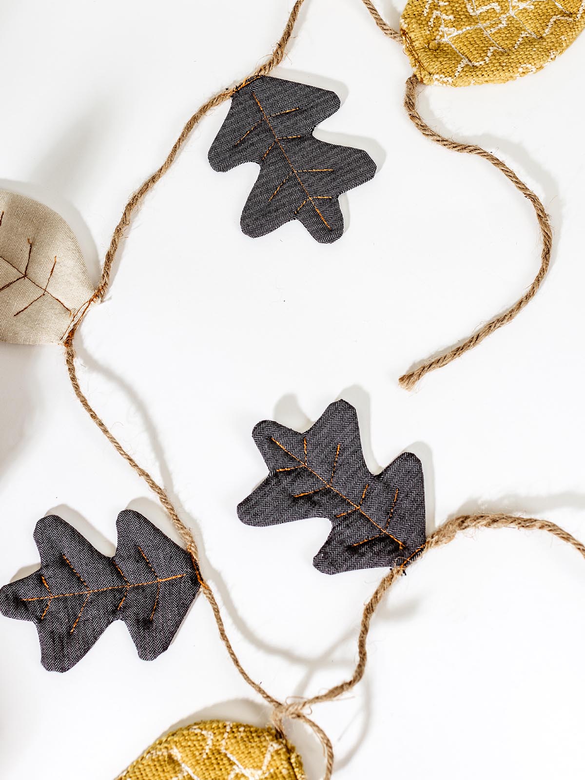 Fall leaf garland on white background. 