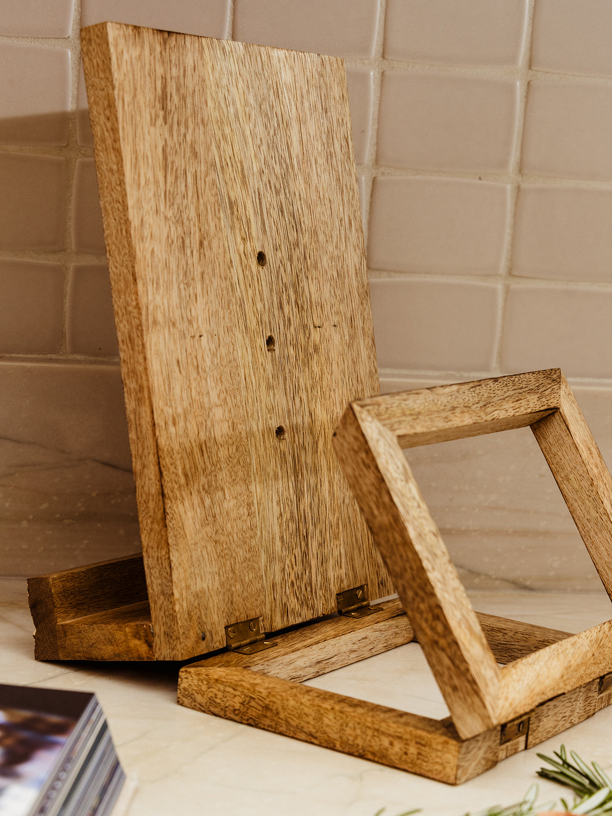 Back of wooden lotus cookbook holder with fold up stand.