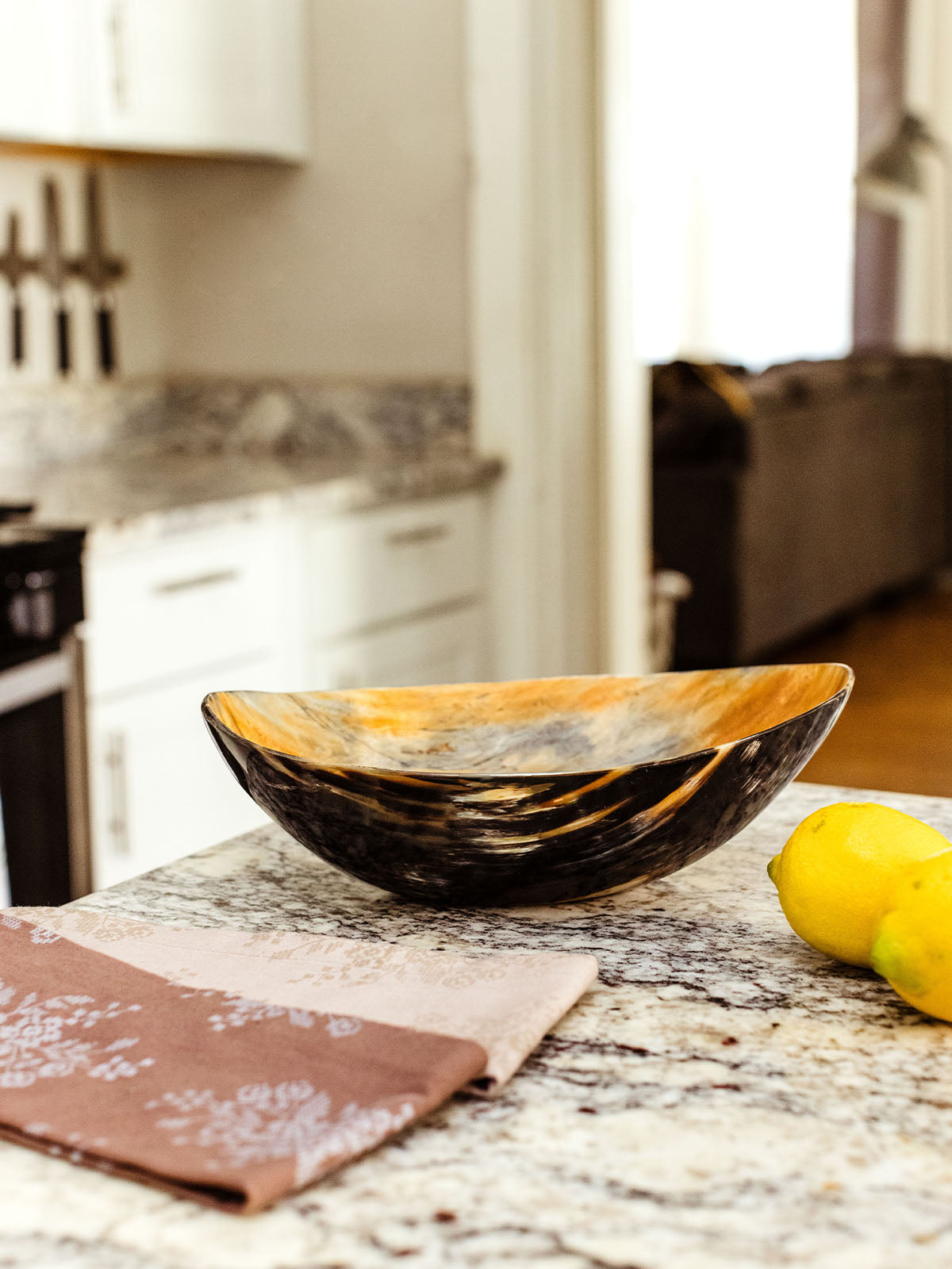 Centerpiece bowl made of horn on kitchen counter.